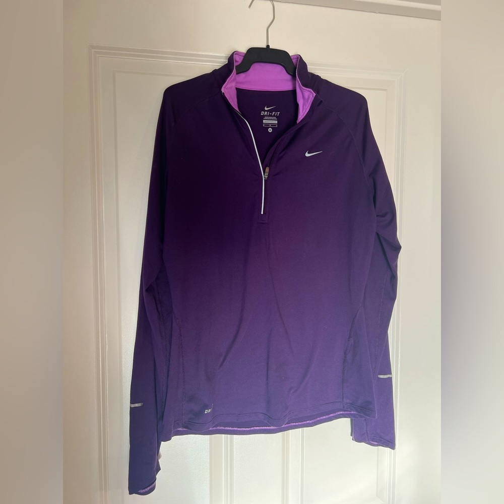 Nike Dri-Fit woman’s half-zip long sleeve running top.